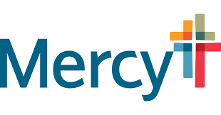 A mercy logo. The Mercy is written in blue and has a red, green, yellow and blue cross to the right of it.